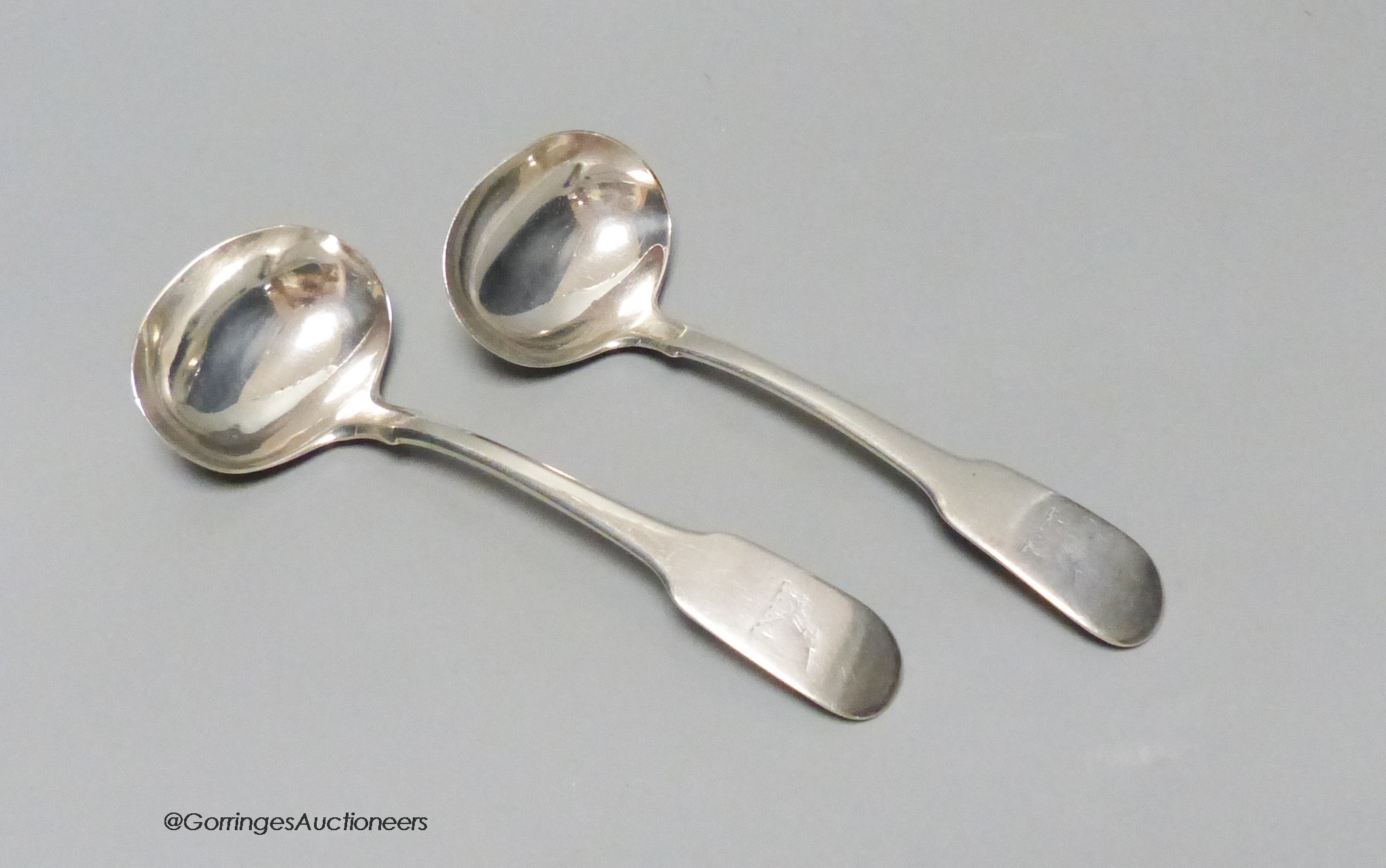 A pair of George IV silver fiddle pattern sauce ladles, by William Bateman, London, 1820, 17.5cm, 137 grams.